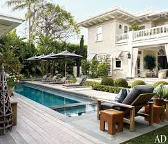 Backyard Outdoor Lap Pool With Sun Umbrella Wooden Banana Lounge Chairs Beautiful Homes Pool Houses Backyard