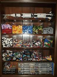 Coastal master bedroom farmhouse master bedroom master bedroom makeover bedroom decor indie bedroom lego vitrine lego regal lego display shelf lego my lego cabinet built using ikea parts. Living Room Display Over 24k Parts And Saturn V Behind Polycarbonate Finally Lego