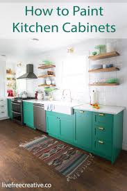 Start by taking a roll of 1.5″ tape (i prefer frog tape for this project) and taping off the edges of the floor next to the walls and cabinet bases. How To Paint Kitchen Cabinets With A Paint Sprayer