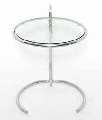A glass coffee table makes for an elegant, subtle addition to the room, while a coffee table with storage is perfect for creating space for a striking centerpiece. Lot Art Eileen Gray Chrome Glass Occasional Table