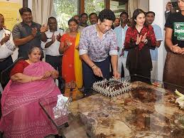 Children walk past a mural of sachin tendulkar on the wall of the village playground at puttamraju kandriga, near gudur, in andhra pradesh. Cricketer Sachin Tendulkar Celebrates His 44th Birthday With Family Sachin Tendulkar Sport Player Birthday