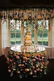 Flowers are only one part of the centerpiece. Wedding Trend Suspended And Hanging Flowers