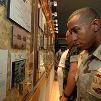 Hospital Corpsman 1st Class Darnell Mason, assigned to Preventative  Medicine Unit Six, looks over the Heroes Wall of Honor during an unveiling  ceremony at the Naval Health Clinic onboard Naval Station Pearl Harbor.