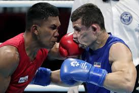 Boxing is a combat sport in which two people, usually wearing protective gloves and other protective equipment such as hand wraps and mouthguards, throw punches at each other for a predetermined amount of time in a boxing ring. Dozens Of Pro Boxers To Take Their Swings At Olympic Gold
