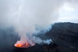 Fountains of high lava burst from the mount nyiragongo into the night sky forming a thick orange cloud over goma, which has a population of two million. Mjfq5cgwi Bjm