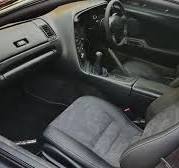 Fiero Car Seat Reupholstering with Black Vinyl and Red Stitch