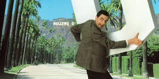 To his right sits his assistant, gareth. Bean The Ultimate Disaster Movie Film British Comedy Guide