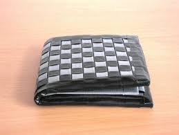 Turn board back to front and attach duct tape along the entire length of the bottom edge of the ribbon. How To Make A Duct Tape Wallet Craft Projects For Every Fan