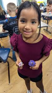 Have you noticed the beautiful zinnias at our elementary school? We want to  keep the vibrant spirit of these flowers alive all year long! Our students  have been transforming pinecones into stunning