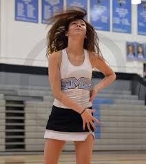Sophomore Katie Reda shows the gym class a warm up to the song Bubble Gum  by Jason Derulo. Photo by Taylor Keal
