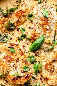 Since we're removing the chicken's skin in this recipe, it's really important to coat it in a thick layer of a yogurt marinade to protect it from drying out. Creamy Parmesan Basil Chicken Recipe