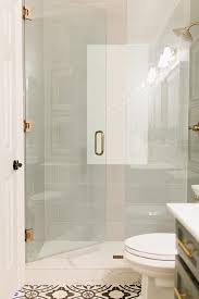 We did not find results for: A Seamless Glass Door Accented With Brushed Gold Hardware Opens To A Walk In Shower Boasting Large Gray Sub Shower Door Hardware Shower Doors Shower Renovation