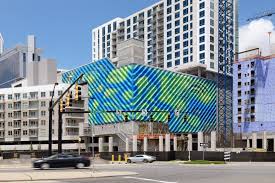 Marc Fornes Theverymany Splashes This Parking Garage With Swirling Colors Archpaper Com Parking Garage Facade Public Art