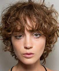 15 Cute Haircuts That Prove The Growing Out Stage Doesn T Have To Be Awkward Growing Out Short Hair Styles Short Hair Styles Growing Out Hair