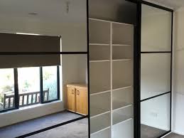 The wardrobe features a gloss finish, two hanging rails, one interior shelf and two drawers and is made. Sliding Doors Make A Stylish Wardrobe Versa Robes