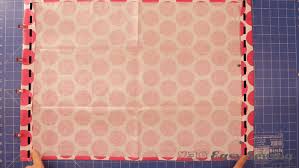 Find the center of one of your hems, and pin the ribbon in place. How To Make A Grocery Bag Holder Easy Sewing For Beginners