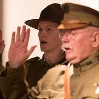 Capt. Arthur W. Kelly chief of splint department showing new adjustable  avduction arm splint perfected for U.S. Army by A.R.C. splint shop. Used  for all types of arm fracture