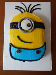 When the icing is set, use an offset spatula to make an upward curving line in the icing about 4 inches from the bottom of the cake. Minion Cakes Decoration Ideas Little Birthday Cakes
