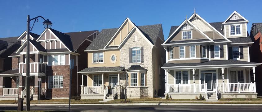 Single family home on a Cornell-style grid street with rear laneway access