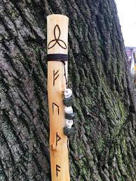 And the words above the giants at the same mural translate: Elder Futhark Maple Hiking Staff Astrolabe Arts