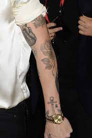 Harry has pingu on the inside of his left arm. Harry Styles Tattoos The True Story Behind 17 Black British Gq