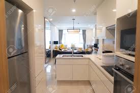 The uncommon style of the modern kitchen island combined with materials not normally found in modern kitchen designs can leave visitors feeling as though they're just sitting down for a drink at the bar. Modern Kitchen Set With Appliances In Studio Flat Stock Photo Picture And Royalty Free Image Image 97921860