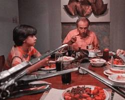 Image of tense family dinner scene in Family Plan movie