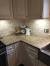 Giallo Ornamental Granite With White Cabinets