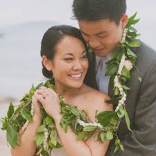 The maile lei is enchanting and sacred; Bride Groom Hawaiian Lei Mango Muse Events Destination Wedding Planner Feature Mango Muse Events