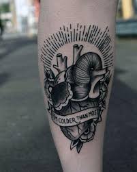 An ornate heart tattoo using ivy to frame the piece. 50 Traditional Heart Tattoo Designs For Men Devotion Ink Ideas