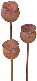Besides, metal decorations last for years and they are perfect to embellish your garden since they will be prone to devasting elements such as raindrop, humidity, and heat. Bornhoft Garden Stakes Poppy Pods Natural Rusty Metal Garden Decoration Patina Trellis Flower Bed Stakes Set Of 3 Amazon De Garden