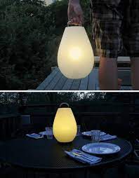 Leave it on the charging base, and it's a stylish table lamp with a dimmable illumination. 5 Cool Outdoor Lamps Lights Lamp Portable Lamps Outdoor Lamp