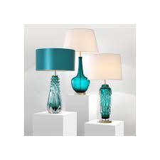The arendell glass table lamp features a captivating aqua blue that flows down to a crystal base. Eicholtz 111601 Table Lamp Massaro Handmade Turquoise Glass Matte Brass Finish Ideas4lighting