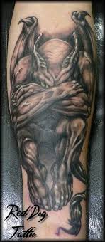 Gothic gargoyle tattoo on upper back. Black Ink Gargoyle Tattoo On Forearm
