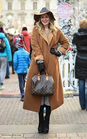 We'd always assumed we preferred it with a grounding, dark, black outfit à la zoe saldana, but then jennifer lawrence had to go mess with our heads by stepping out with hers worn over a white. Chic Street Look Camel Coat And Fedora Hat Fashion Trends And Street Style People Styles