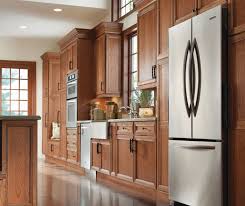 casual cherry kitchen cabinets in sage