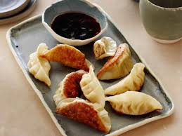 Place a plate on top of gyoza. Pork Gyoza With Ginger Dipping Sauce Recipe Cooking Channel