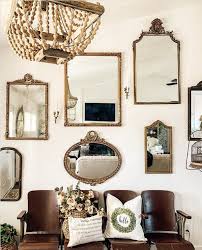 Sometimes the simplest design ideas don't involve the standard home decor. 13 Mirrors Gallery Walls Ideas To Copy Mirror Gallery Wall Mirror Wall Living Room Antique Mirror Wall