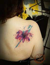 These tattoos actually look like they have been painted onto the skin. 25 Examples Of Artistic Watercolor Tattoos Lily Tattoo Stargazer Lily Tattoo Watercolor Tattoo Flower