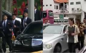 Smiling young malay man using watch before jogging in park. Malay Wedding Groomsmen Escort Bridal Car A La North Korea S Jogging Bodyguards Coconuts Singapore