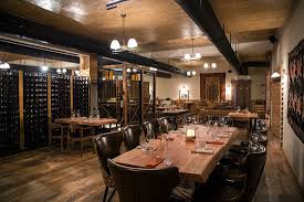 Dining room wine closet featuring a sloped ceiling displaying modern vertical aluminum wine racks next to an arched doorway. Dining Area And Wine Storage Picture Of Sirajkhana Wine Restaurant Tbilisi Tripadvisor
