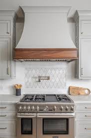 Maybe you would like to learn more about one of these? Light Gray French Hood With An Oak Trim In A Transitional Kitchen Cooktop Above A Thermador Range F Kitchen Cooktop Kitchen Hood Design Country Kitchen Designs