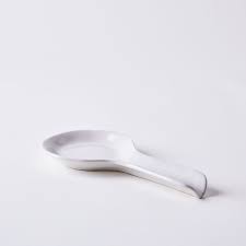 Spoon rest sits on or next to the stove (not on a burner) to hold messy spoons after stirring a pot. Simple Ceramic Spoon Rest On Food52