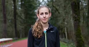 Olympic team during the trials — shifted to face the stands rather than the flag before holding up a black shirt that reads activist athlete. Opinion Gwen Berry I Raised My Fist In Protest The Olympics Punished Me The New York Times