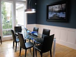 Contemporary Dining Room With Navy Accent Wall And Glass Table Dining Room Blue Dining Room Contemporary White Wainscoting