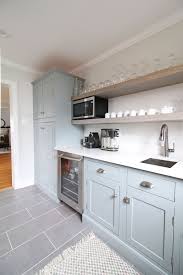 Light Blue Green Cabinets In This Transitional Farmhouse Butler S Pantry Perfectly Compleme Green Cabinets Light Blue Kitchens Kitchens Without Upper Cabinets