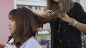 Is the hair salon near me famous? Young Asian Woman Getting Hairdressing Hair Salon Hairdresser Cutting Female Video By C Cherayut000 Stock Footage 246700686