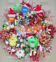 M M Christmas Whimsical Holiday Wreath Bright And Colorful Snowflakes Garland Candy Canes Full Custom De Christmas Floral Christmas Wreaths Diy Holiday Wreaths