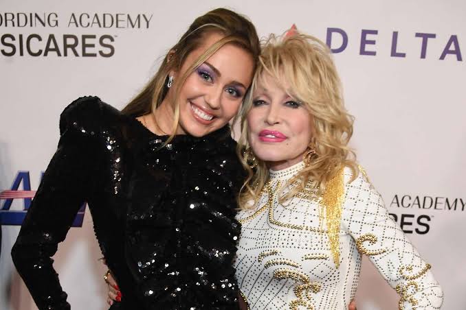 How Did Dolly Parton Become Miley Cyrus' Godmother?