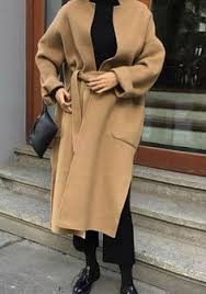 Not only is it the best way to give your exhausted black coat a rest, but the golden color makes every outfit feel a little more sophisticated and refined. The Camel Coat